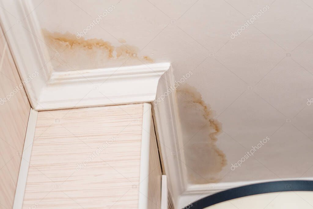 Water stained ceiling with visible damage before handyman repair