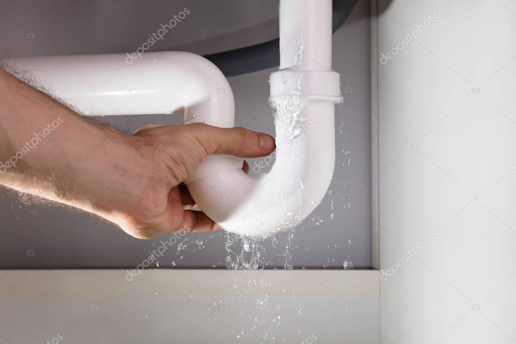 Dripping bathroom faucet before handyman repair