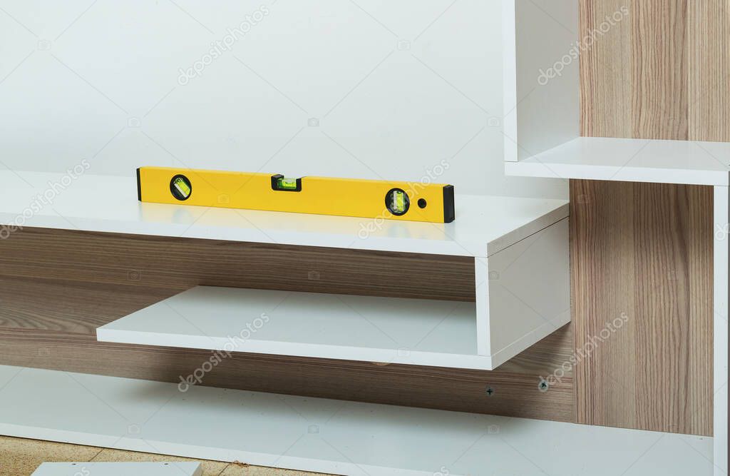 Wall shelf reinstalled straight and securely anchored